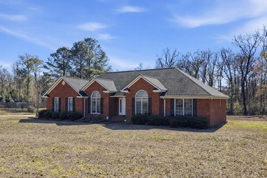 NEW PRICE! Welcome home to 104 Johns Drive, a timeless brick