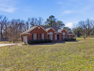 NEW PRICE! Welcome home to 104 Johns Drive, a timeless brick