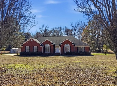 NEW PRICE! Welcome home to 104 Johns Drive, a timeless brick