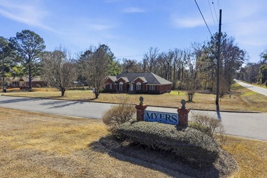 NEW PRICE! Welcome home to 104 Johns Drive, a timeless brick