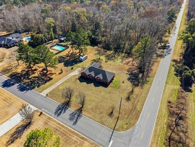 NEW PRICE! Welcome home to 104 Johns Drive, a timeless brick