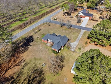 NEW PRICE! Welcome home to 104 Johns Drive, a timeless brick