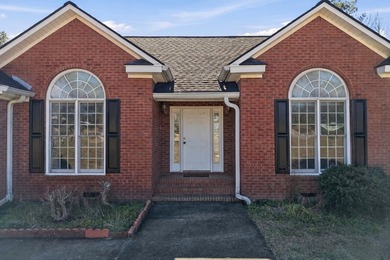 NEW PRICE! Welcome home to 104 Johns Drive, a timeless brick