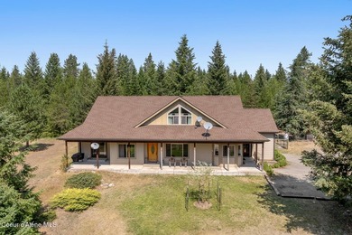 Beautiful 2,738SF Rancher on 9.91 treed, level, horse-friendly - photo 1