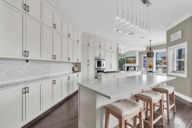 THIS CUSTOM-BUILT WATERFRONT RESIDENCE is elevated & offers an - photo 16