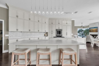 THIS CUSTOM-BUILT WATERFRONT RESIDENCE is elevated & offers an - photo 17