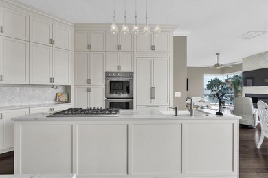 THIS CUSTOM-BUILT WATERFRONT RESIDENCE is elevated & offers an - photo 18