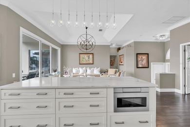 THIS CUSTOM-BUILT WATERFRONT RESIDENCE is elevated & offers an - photo 19