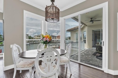THIS CUSTOM-BUILT WATERFRONT RESIDENCE is elevated & offers an - photo 21