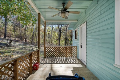 This cozy 1-bed, 1-bath updated camp house offers a serene - photo 2