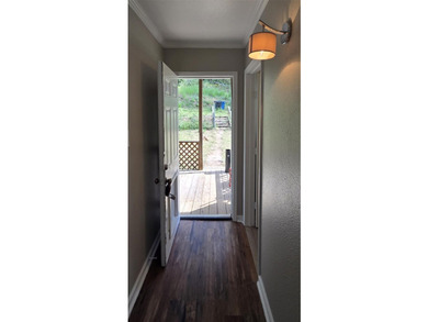 This cozy 1-bed, 1-bath updated camp house offers a serene - photo 3