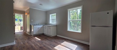 This cozy 1-bed, 1-bath updated camp house offers a serene - photo 5