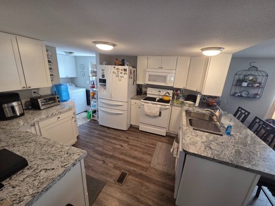 Please Note: This home is located on leased land and does not - photo 3