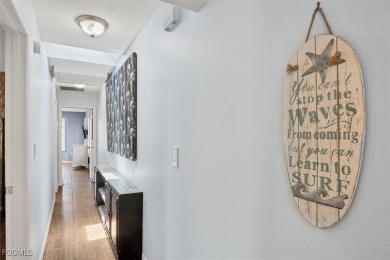 Discover effortless coastal charm in this rare end-unit villa