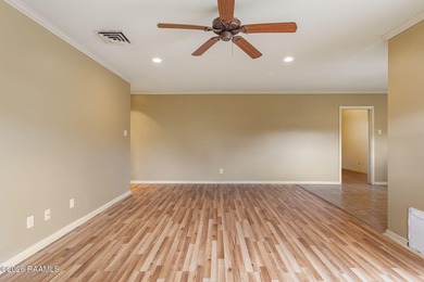 Underneath the branches of a mature live oak tree sits this