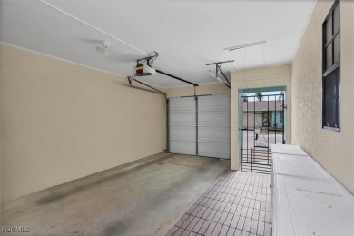 Discover effortless coastal charm in this rare end-unit villa