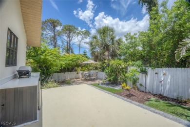 Discover effortless coastal charm in this rare end-unit villa