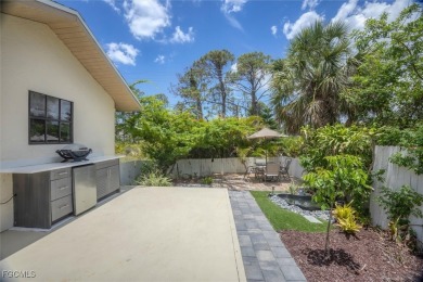 Discover effortless coastal charm in this rare end-unit villa