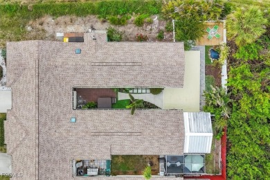 Discover effortless coastal charm in this rare end-unit villa