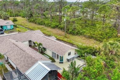 Discover effortless coastal charm in this rare end-unit villa