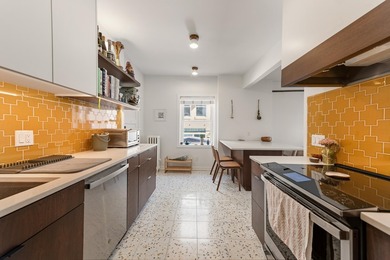 This spacious condo blends historic charm with thoughtful modern - photo 2