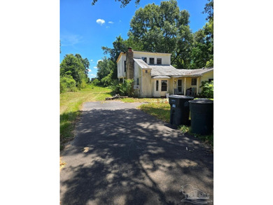 Endless Potential on Nearly an Acre! This 3-bedroom, 2-bath home - photo 1