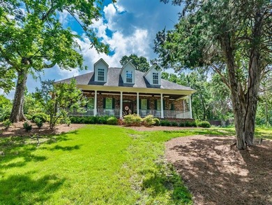 Southern charm shines through in this immaculately maintained - photo 1