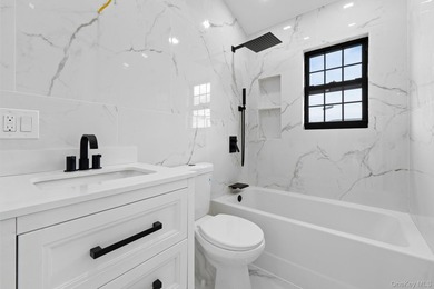 241-49-148th Drive is a meticulously renovated two family tucked - photo 3