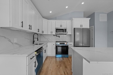 241-49-148th Drive is a meticulously renovated two family tucked - photo 7