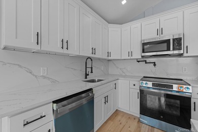 241-49-148th Drive is a meticulously renovated two family tucked - photo 9