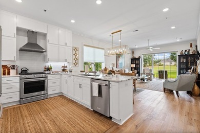 Enjoy golf course living in this beautifully positioned - photo 4