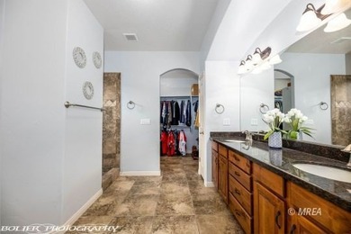 Corner lot with a beautiful home. The front walk way leads up to