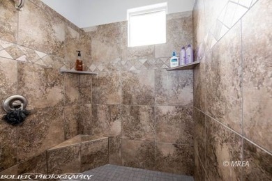 Corner lot with a beautiful home. The front walk way leads up to