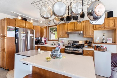 This charming two-story home sits right on the water's edge of - photo 11