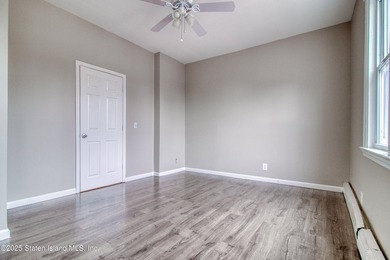 Rare find! This legal three-family home offers exceptional - photo 12