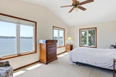 This charming two-story home sits right on the water's edge of - photo 15