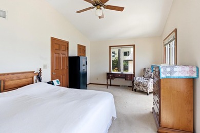 This charming two-story home sits right on the water's edge of - photo 16