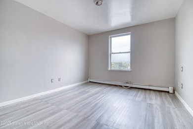 Rare find! This legal three-family home offers exceptional - photo 19