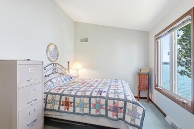 This charming two-story home sits right on the water's edge of - photo 20