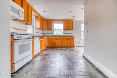 Rare find! This legal three-family home offers exceptional - photo 20