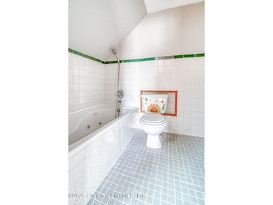 Rare find! This legal three-family home offers exceptional - photo 32