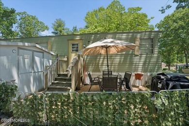 Welcome home! This stylish mobile home offers two bedrooms, a - photo 15