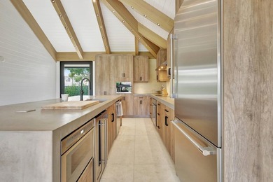 Welcome to an extraordinary residence that seamlessly blends - photo 7