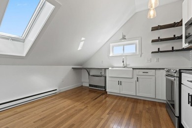Perched above-it-all in Bayside, this freshly painted penthouse - photo 4