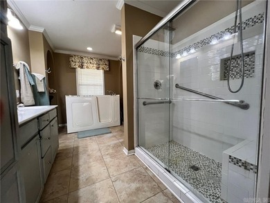 Well-maintained home on approximately 6 acres with a stocked