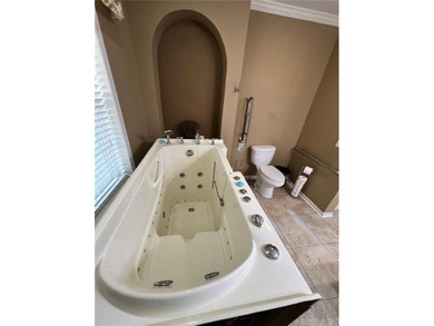 Well-maintained home on approximately 6 acres with a stocked