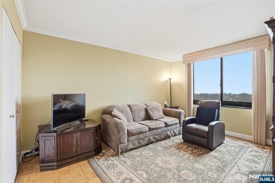 Welcome to Residence 14R at the Atrium, a beautifully maintained