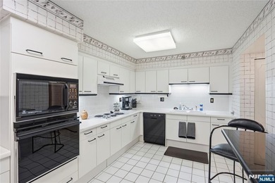 Welcome to Residence 14R at the Atrium, a beautifully maintained