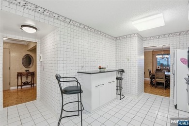 Welcome to Residence 14R at the Atrium, a beautifully maintained