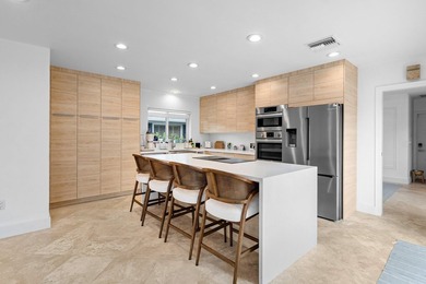 Welcome to this exceptional single-story waterfront residence in - photo 12
